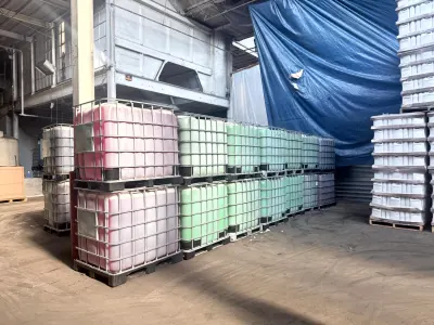 Rows of IBC totes holding coolant in several colors